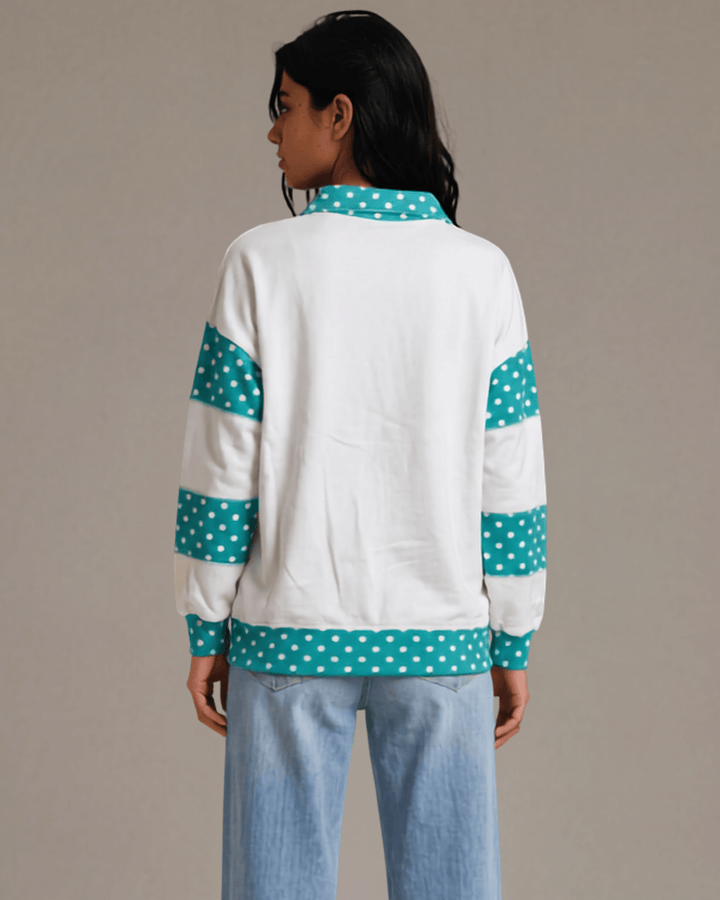 Made in USA. White French terry pullover with teal polka dot contrast collar, sleeves &amp; hem. Open V-neck, relaxed fit. 95% cotton. Sizes S–L.