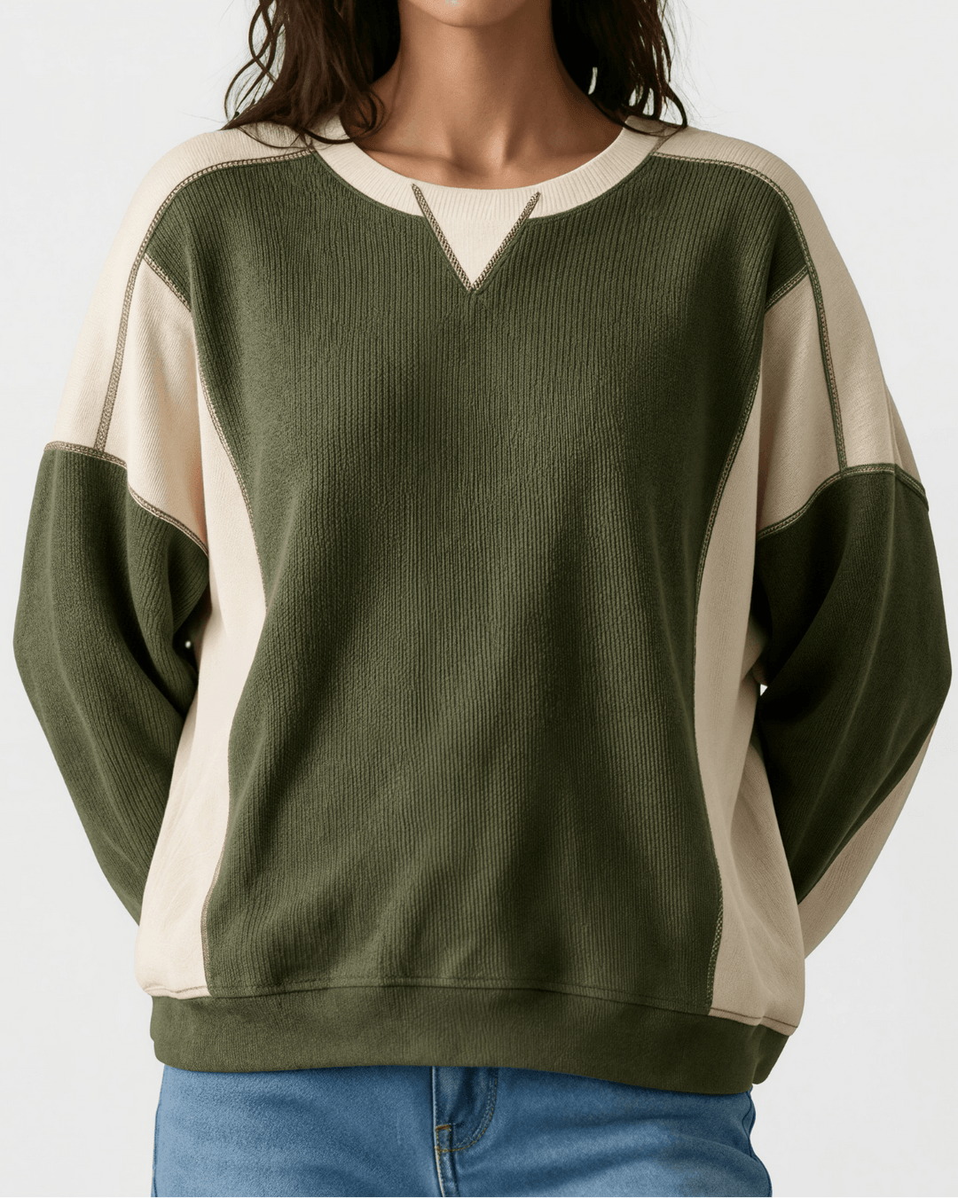 Made in USA. Olive & cream color block ribbed knit sweatshirt. Notched neck, exposed seams, oversized fit. 97% polyester. Sizes S–XL.