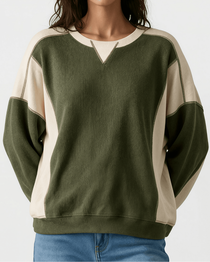 Made in USA. Olive &amp; cream color block ribbed knit sweatshirt. Notched neck, exposed seams, oversized fit. 97% polyester. Sizes S–XL.
