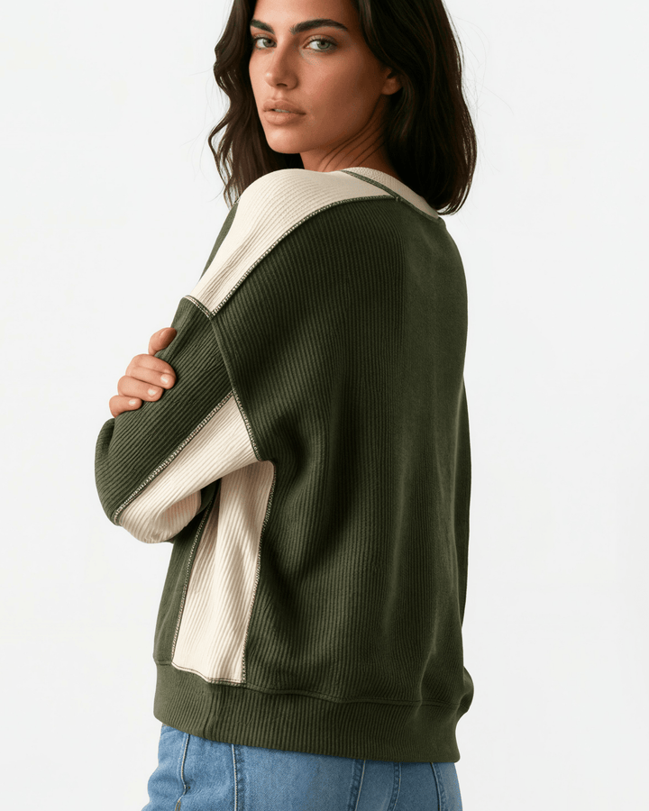 Made in USA. Olive &amp; cream color block ribbed knit sweatshirt. Notched neck, exposed seams, oversized fit. 97% polyester. Sizes S–XL.