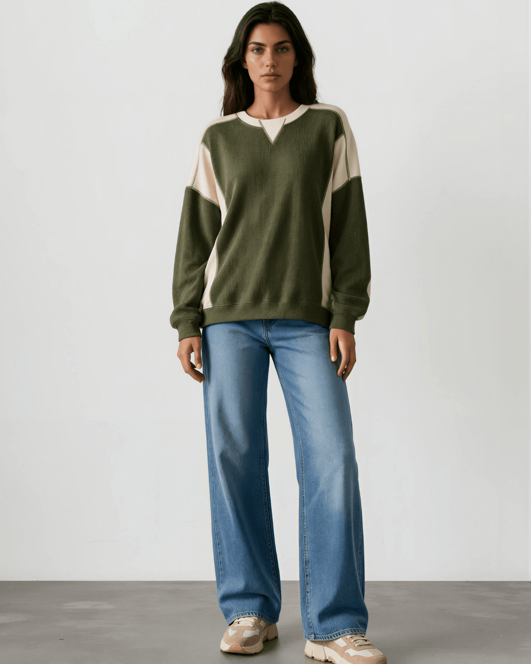 Made in USA. Olive &amp; cream color block ribbed knit sweatshirt. Notched neck, exposed seams, oversized fit. 97% polyester. Sizes S–XL.