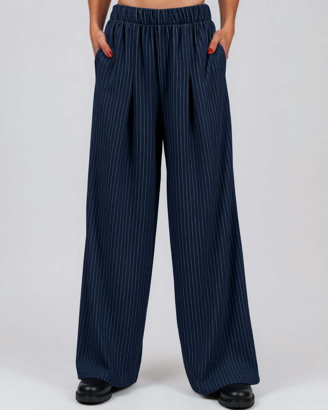 Made in USA Avery Women's high-rise wide leg pinstripe pant in navy. Elastic waist, pleated front, full length. 85% rayon, 15% linen. 