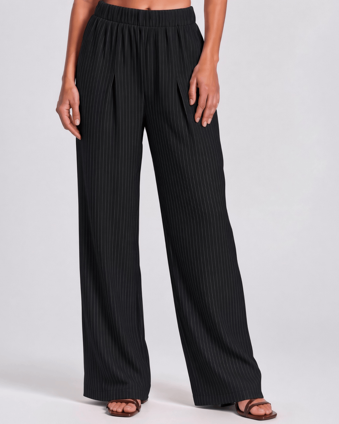 Made in USA Women's Avery high-rise wide leg pinstripe pant in black. Elastic waist, pleated front, full length. 85% rayon, 15% linen. 
