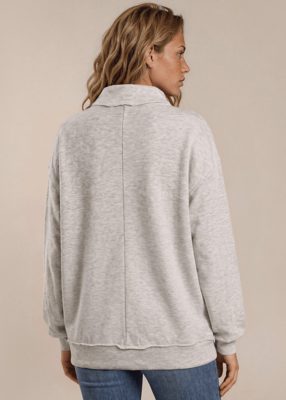 Cozy oversized women's mock neck sweatshirt in heather grey. Drop shoulder, ribbed cuffs, super soft fabric. Made in USA. Sizes S–L.