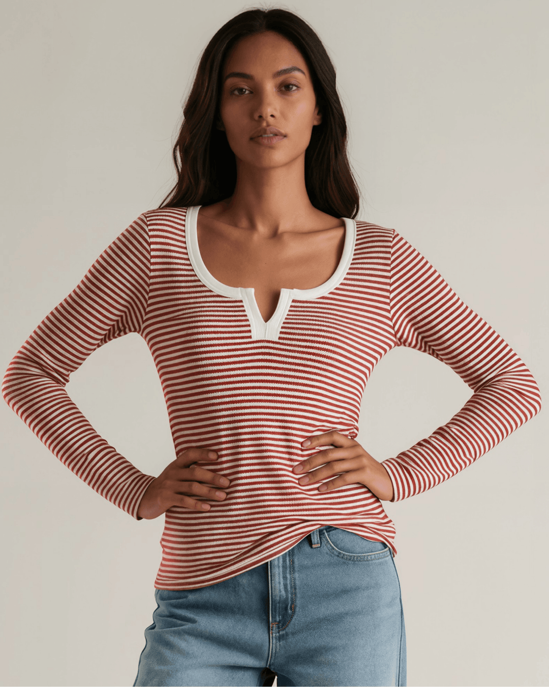 Made in USA. Burgundy & Off White striped fitted rib knit top. Split V-neck with contrast trim, long sleeves. 97% rayon. Sizes S–XL.