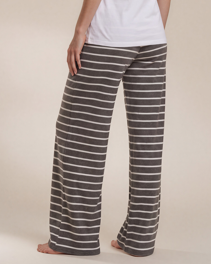 Made in USA. Relax in charcoal striped wide-leg pajama pants with an elastic drawstring waist, side pockets and soft stretch fabric. Sizes S–XL.