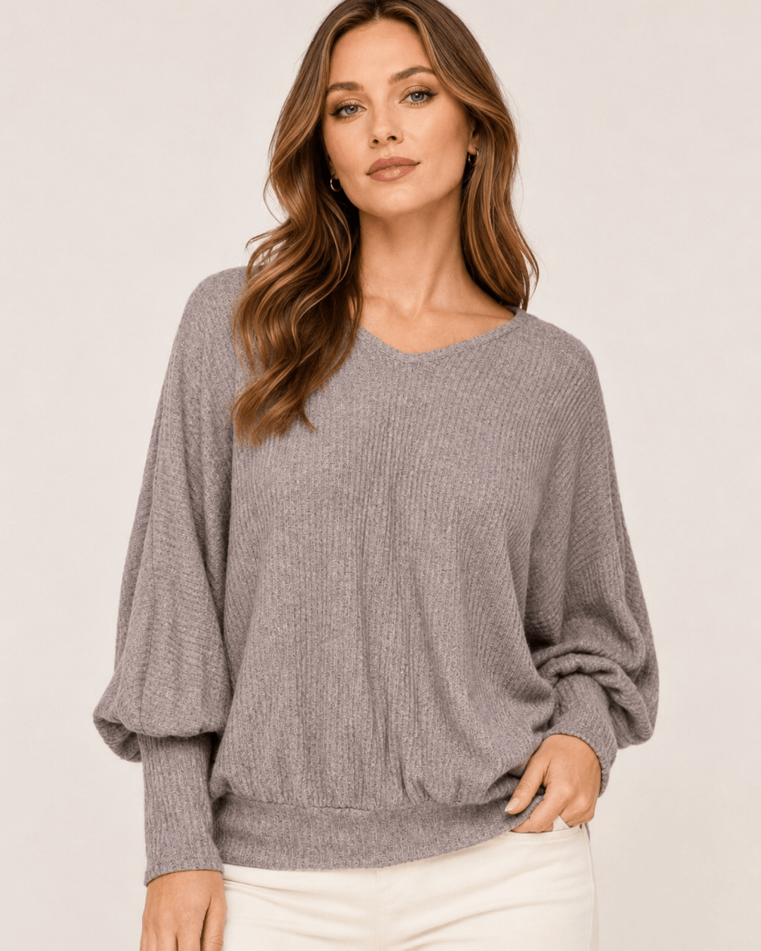 Made in USA. Women's light gray ribbed dolman top with balloon sleeves, a V-neck, and a relaxed fit in soft, lightweight knit.