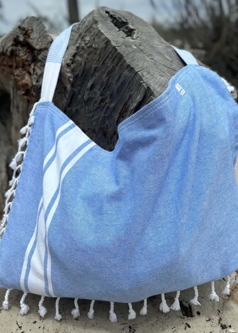 Shop the Beachables Solid 3-in-1 Turkish Cotton Beach Bag – converts from bag to towel to chair cover. Sand-resistant, quick-dry, machine washable. Made in USA.