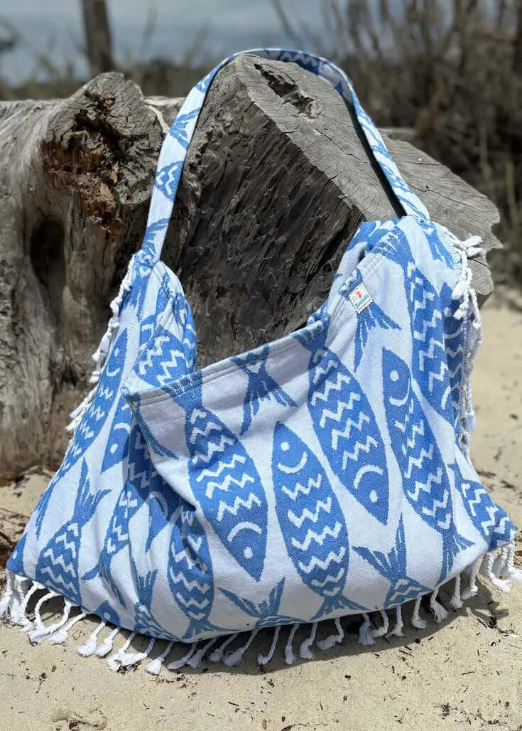 Shop the Beachables Pattern 3-in-1 Turkish Cotton Beach Bag – converts from bag to towel to chair cover. Sand-resistant, quick-dry, machine washable. Made in USA.