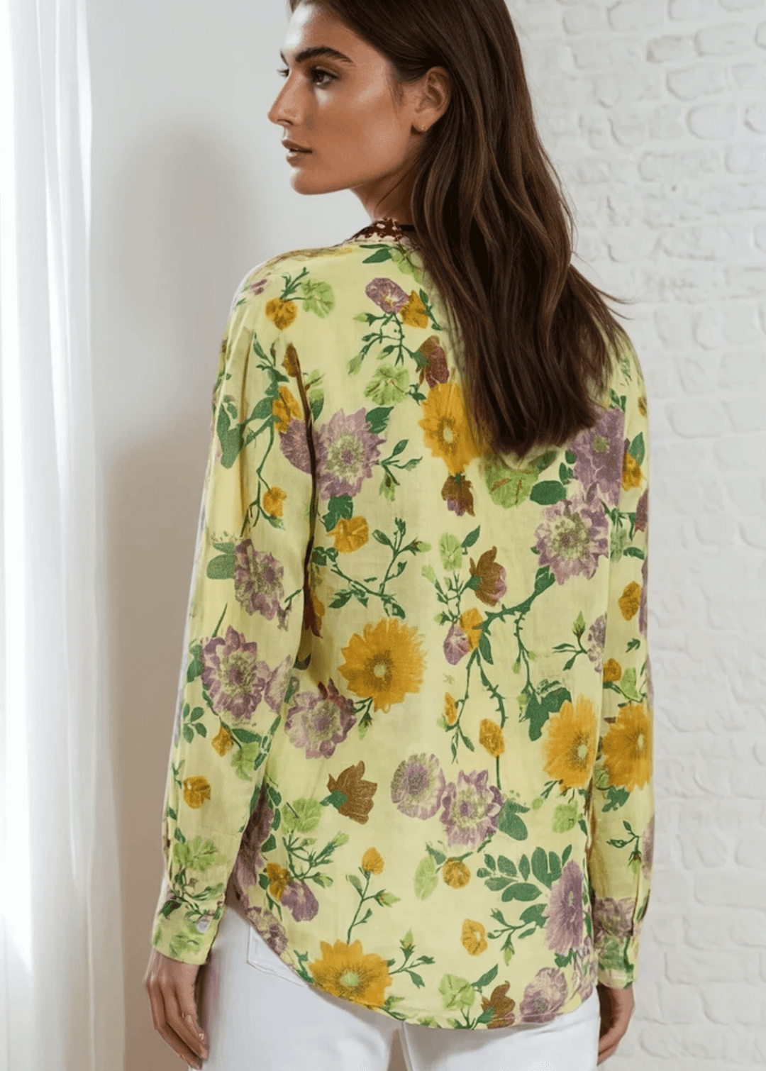 Bask in the beauty of effortless bohemian charm with the Carla Top. Crafted from soft, breathable cotton voile, this piece features a vibrant floral print in sun-kissed tones of golden marigold, lilac, and fresh green. The hand-embroidered deep red bib adds an artisanal touch, making each blouse unique. Designed with a relaxed silhouette and a flattering V-neckline, it&