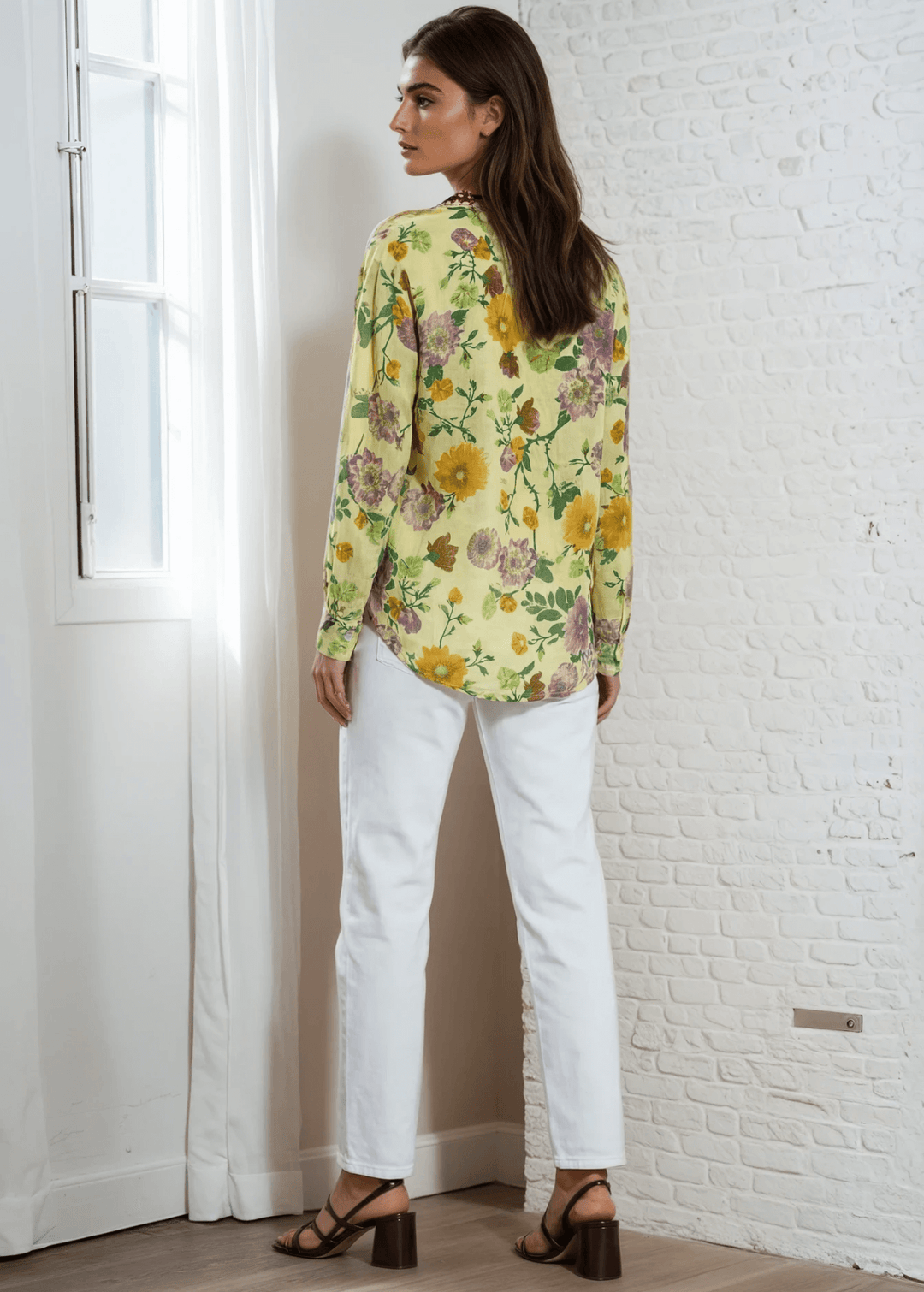 Bask in the beauty of effortless bohemian charm with the Carla Top. Crafted from soft, breathable cotton voile, this piece features a vibrant floral print in sun-kissed tones of golden marigold, lilac, and fresh green. The hand-embroidered deep red bib adds an artisanal touch, making each blouse unique. Designed with a relaxed silhouette and a flattering V-neckline, it&