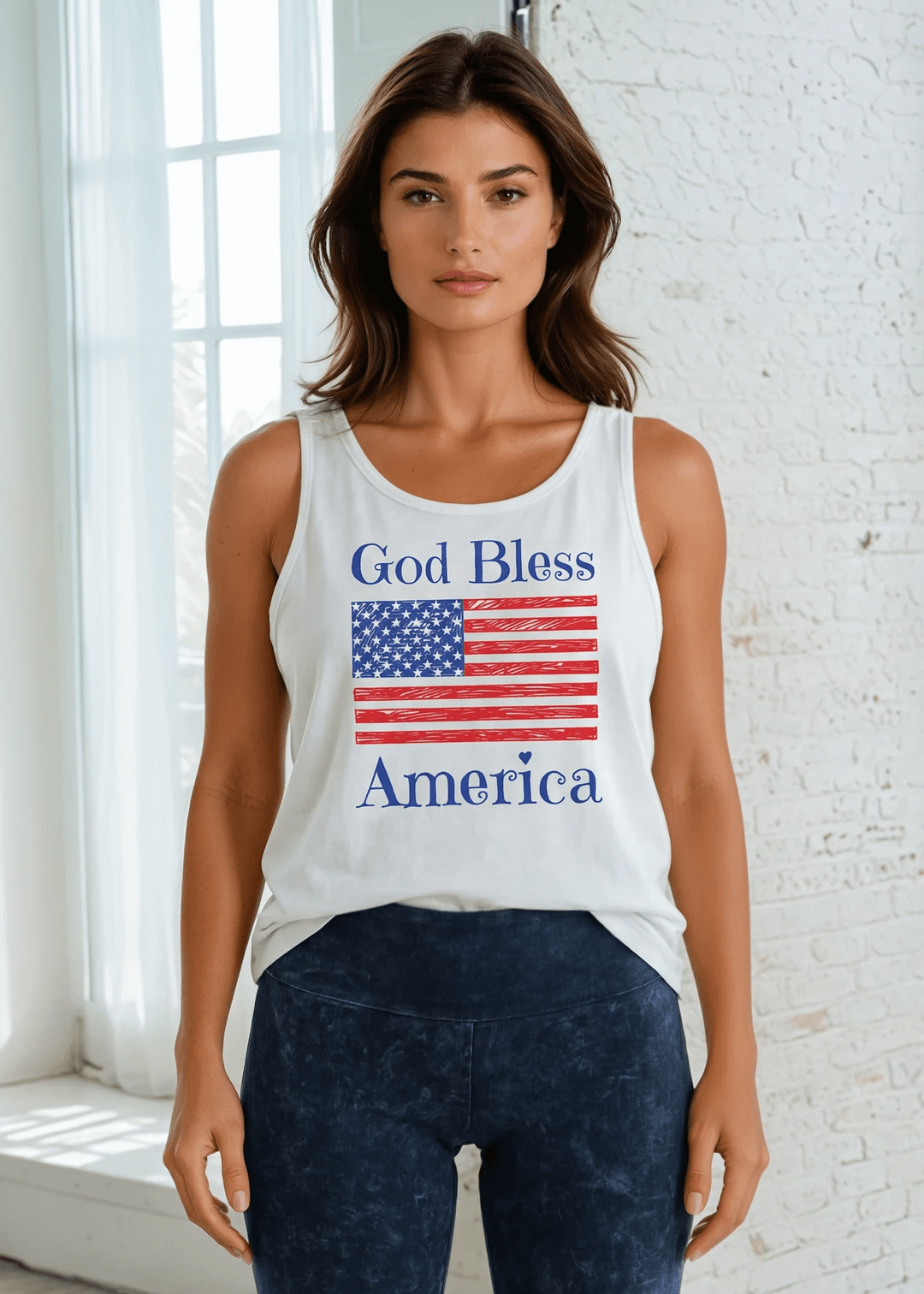 God Bless America Flag Graphic Tank Top | Made in USA Cotton, Say it in something made here! USA-made God Bless America flag graphic tank in white garment wash. Soft 95% cotton, relaxed fit, grown &amp; sewn in America.
