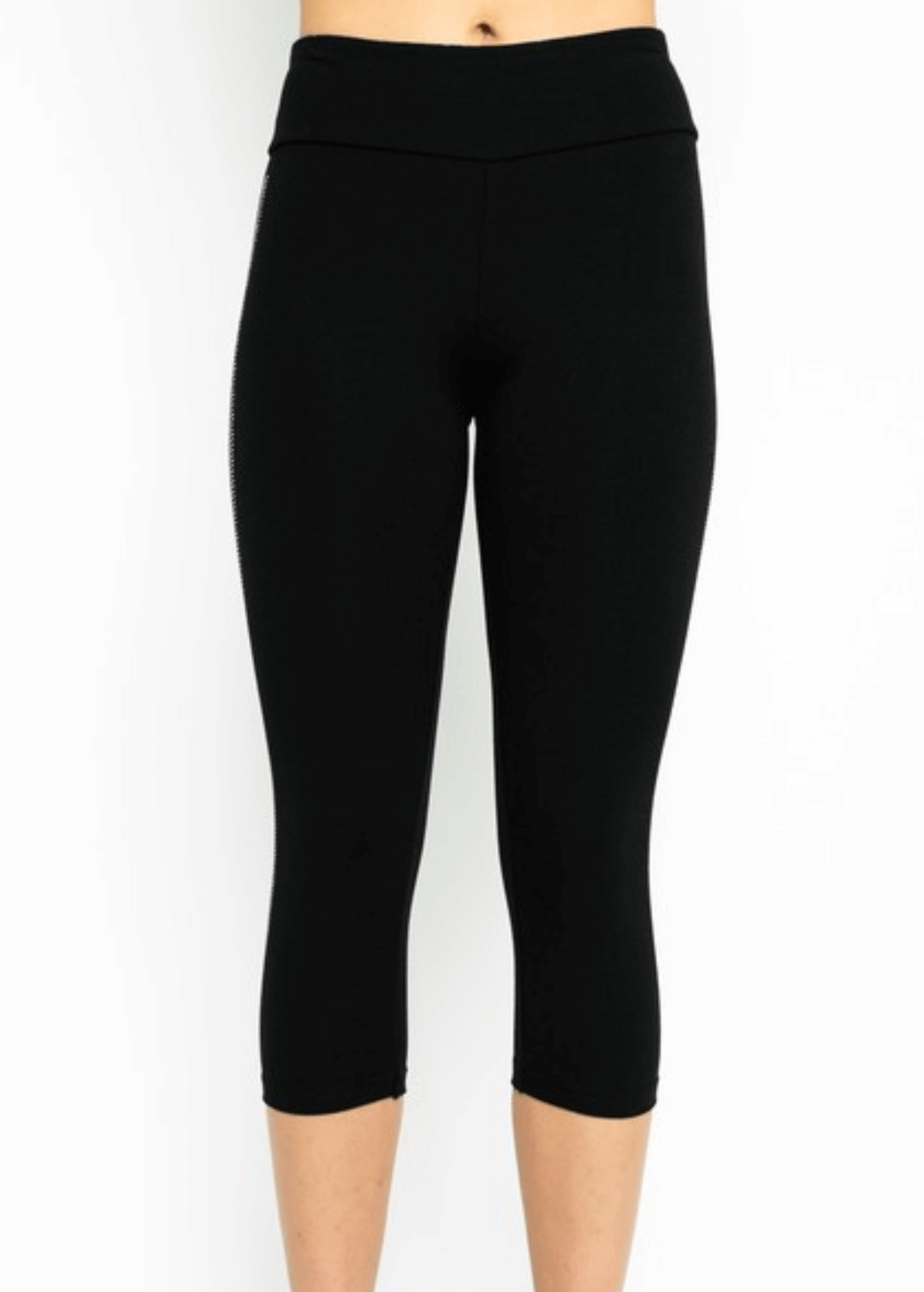 Meet the Carmen Capri Leggings in Black—American-made quality you can feel the difference in. These sleek black capris feature a striking side stripe embellished with shimmering stones, adding just the right touch of glamour to your everyday look.