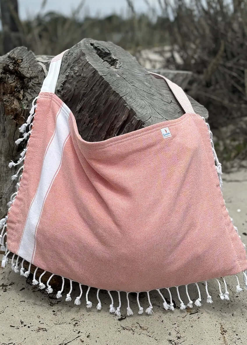 Shop the Beachables Solid 3-in-1 Turkish Cotton Beach Bag – converts from bag to towel to chair cover. Sand-resistant, quick-dry, machine washable. Made in USA.