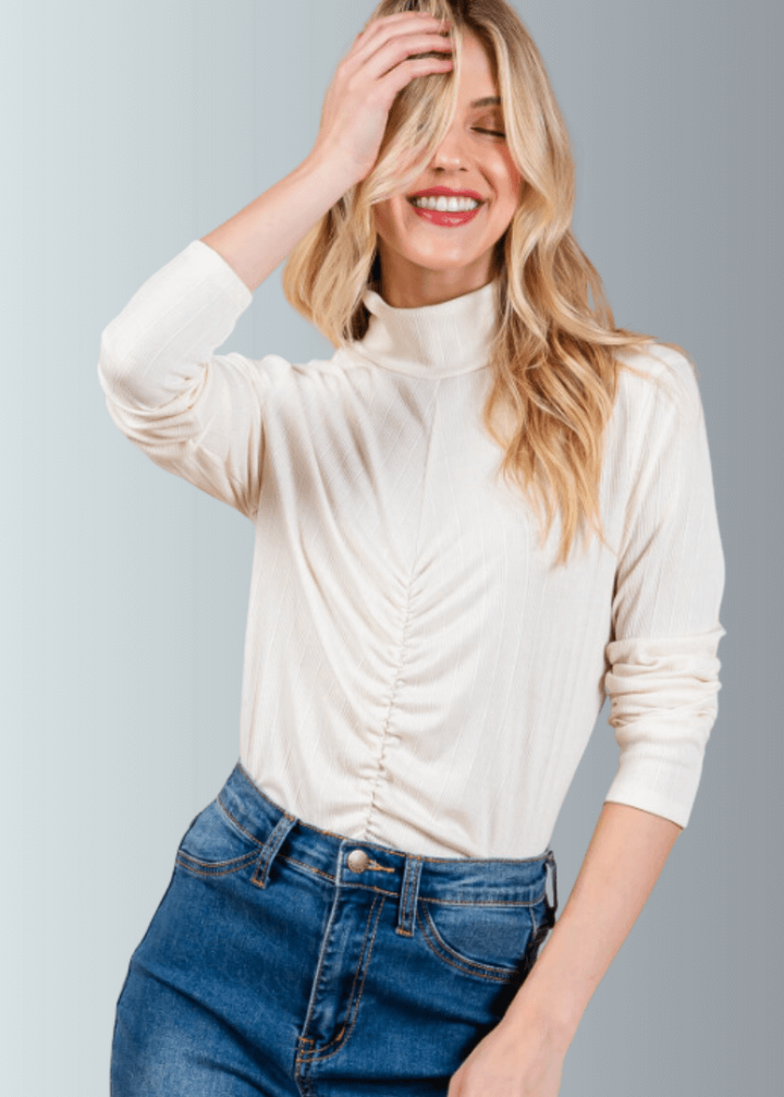This Long Sleeve Mock Neck Top is a must-have for any wardrobe. It&