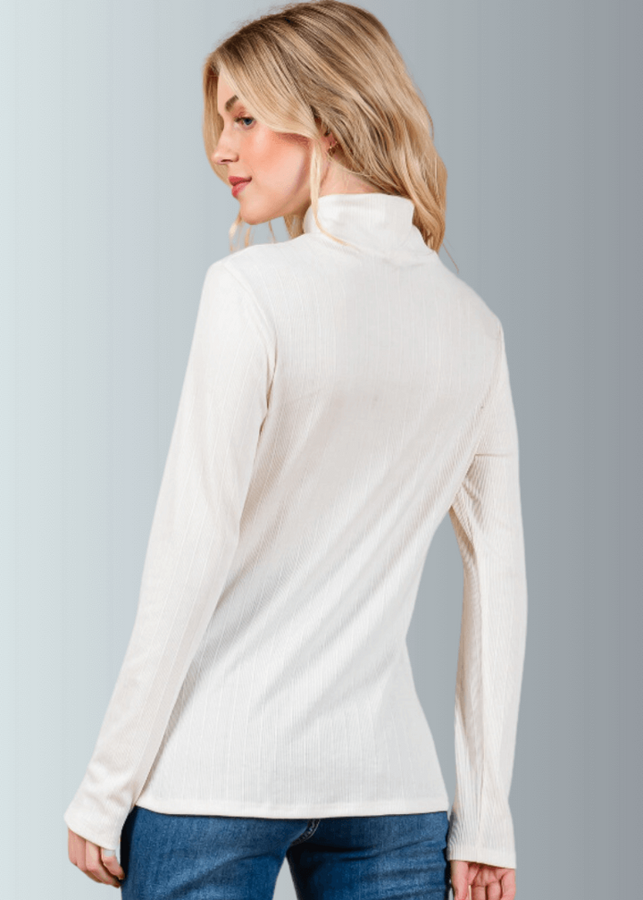 This Long Sleeve Mock Neck Top is a must-have for any wardrobe. It&