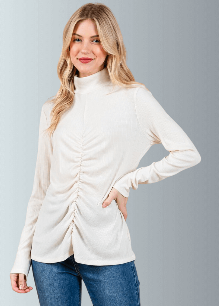 This Long Sleeve Mock Neck Top is a must-have for any wardrobe. It&