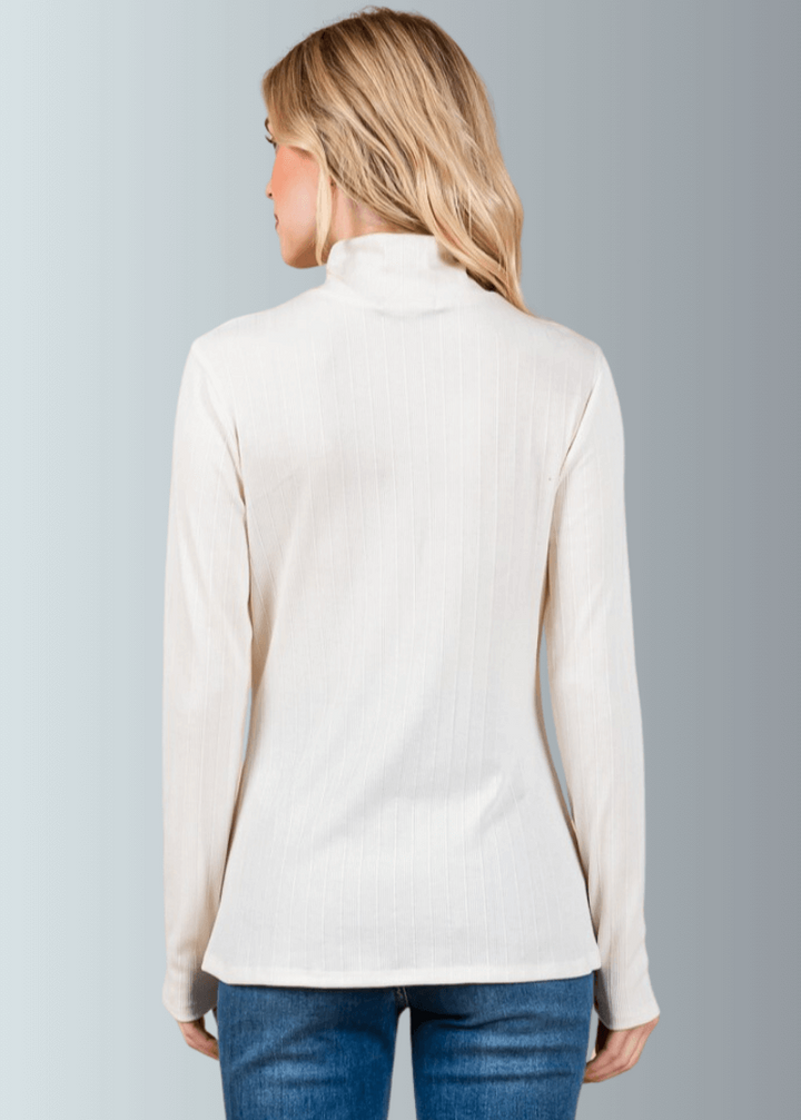 This Long Sleeve Mock Neck Top is a must-have for any wardrobe. It&