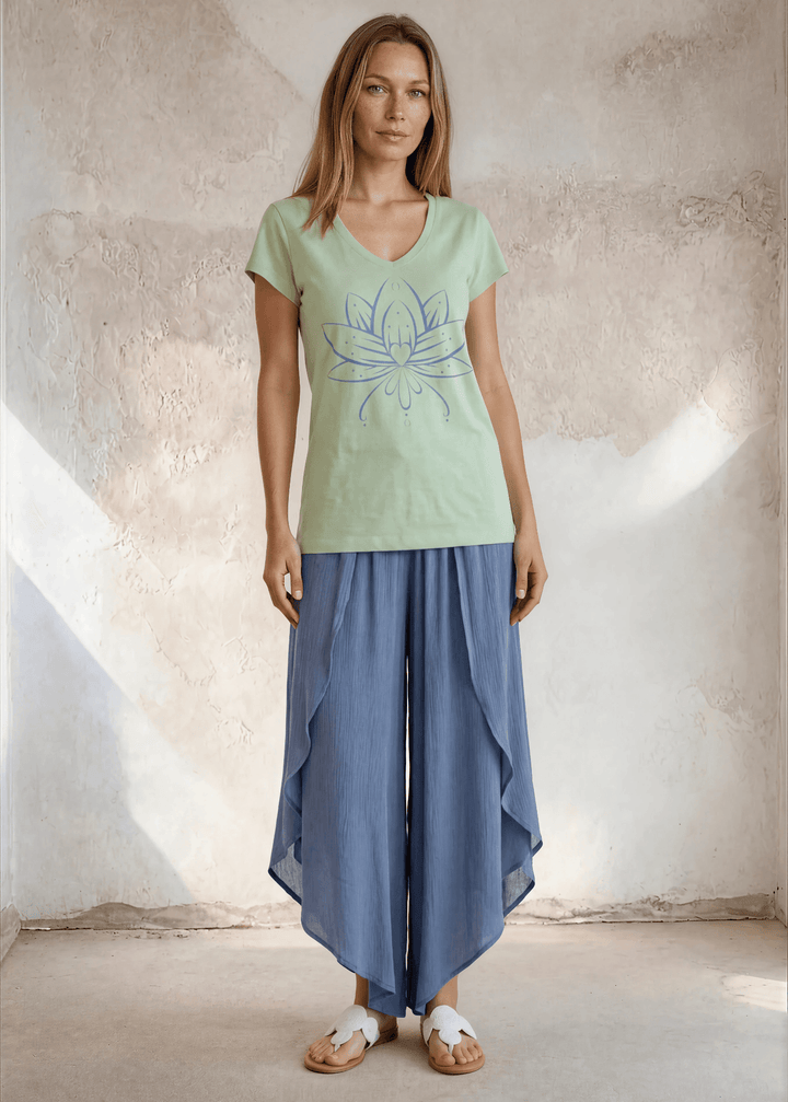 Shop the Meghan Tee — a garment-dyed, fitted scoop neck tee in Neil Green with a Denim Blue Flower Graphic. 50% cotton / 50% modal, ultra-soft. Made in USA.