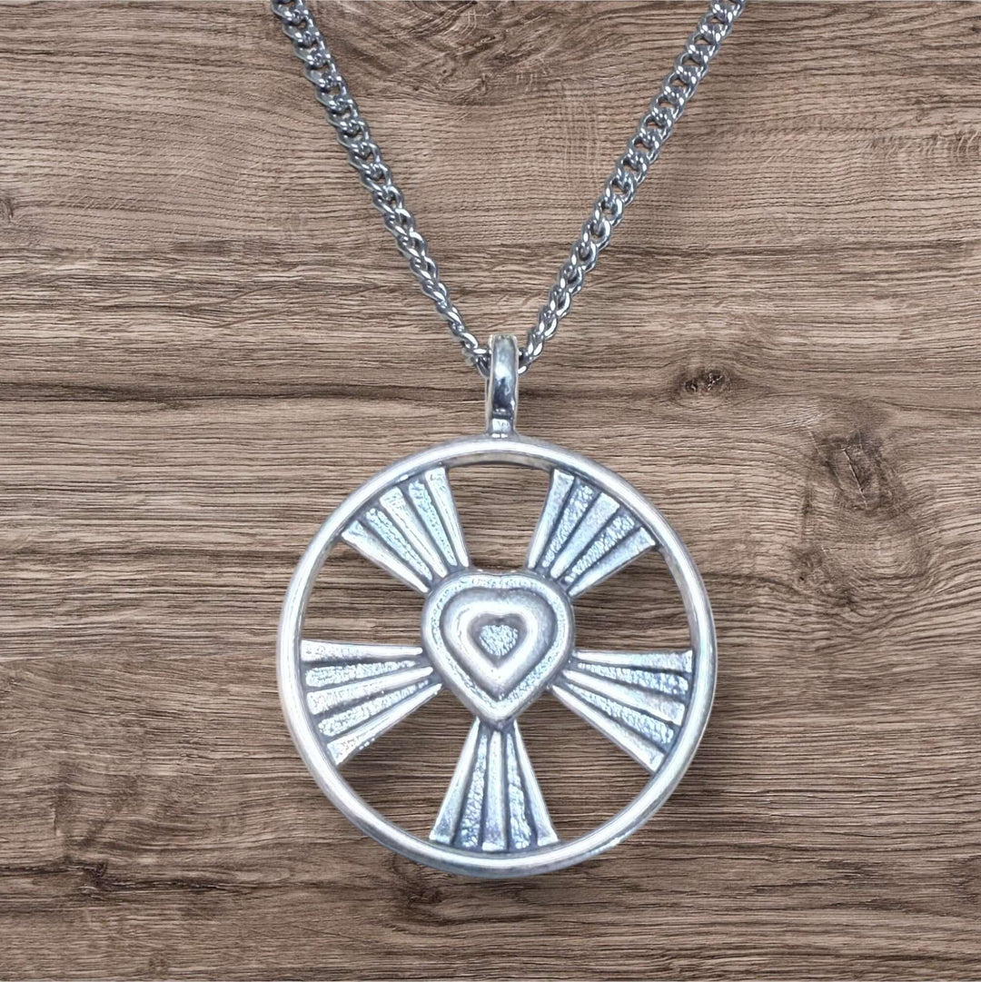 Handcrafted solid bronze shining heart necklace on an antique bronze chain. A timeless gift of love. Made in USA with a lifetime warranty.