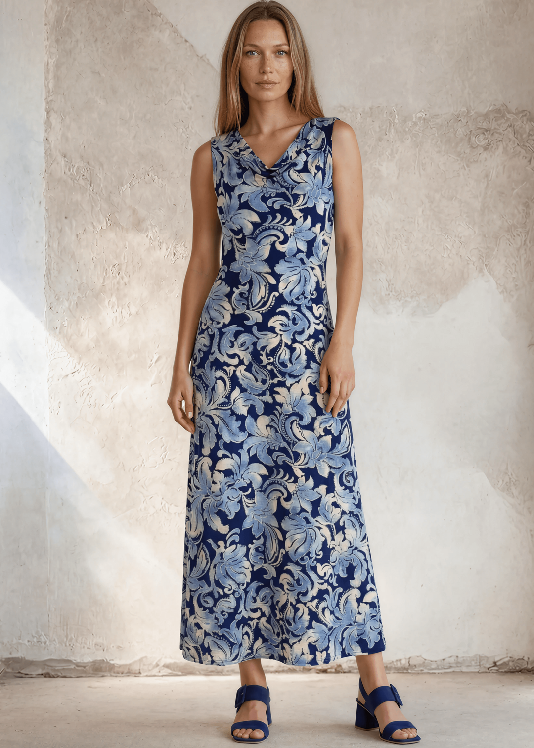 USA-made women's sleeveless navy floral maxi dress. Draped V-neckline, baroque print, comfort stretch, sizes S–XL