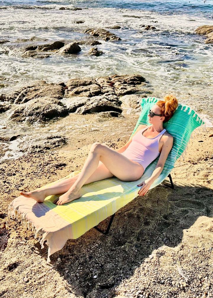 Shop the Beachables Striped 3-in-1 Turkish Cotton Beach Bag – converts from bag to towel to chair cover. Sand-resistant, quick-dry, machine washable. Made in USA.