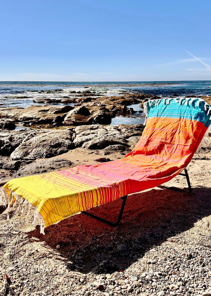 Shop the Beachables Striped 3-in-1 Turkish Cotton Beach Bag – converts from bag to towel to chair cover. Sand-resistant, quick-dry, machine washable. Made in USA.