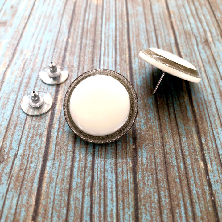 Vintage beveled disc studs in white resin &amp; silver glitter, 24mm. Surgical steel posts, lightweight. 1960s Lucite, handcrafted in the USA.