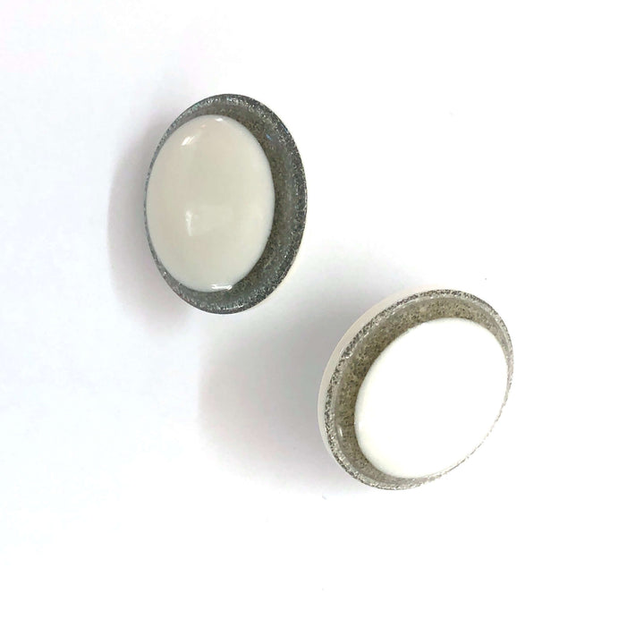 Vintage beveled disc studs in white resin &amp; silver glitter, 24mm. Surgical steel posts, lightweight. 1960s Lucite, handcrafted in the USA.