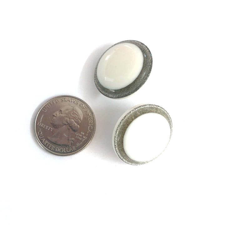 Vintage beveled disc studs in white resin &amp; silver glitter, 24mm. Surgical steel posts, lightweight. 1960s Lucite, handcrafted in the USA.