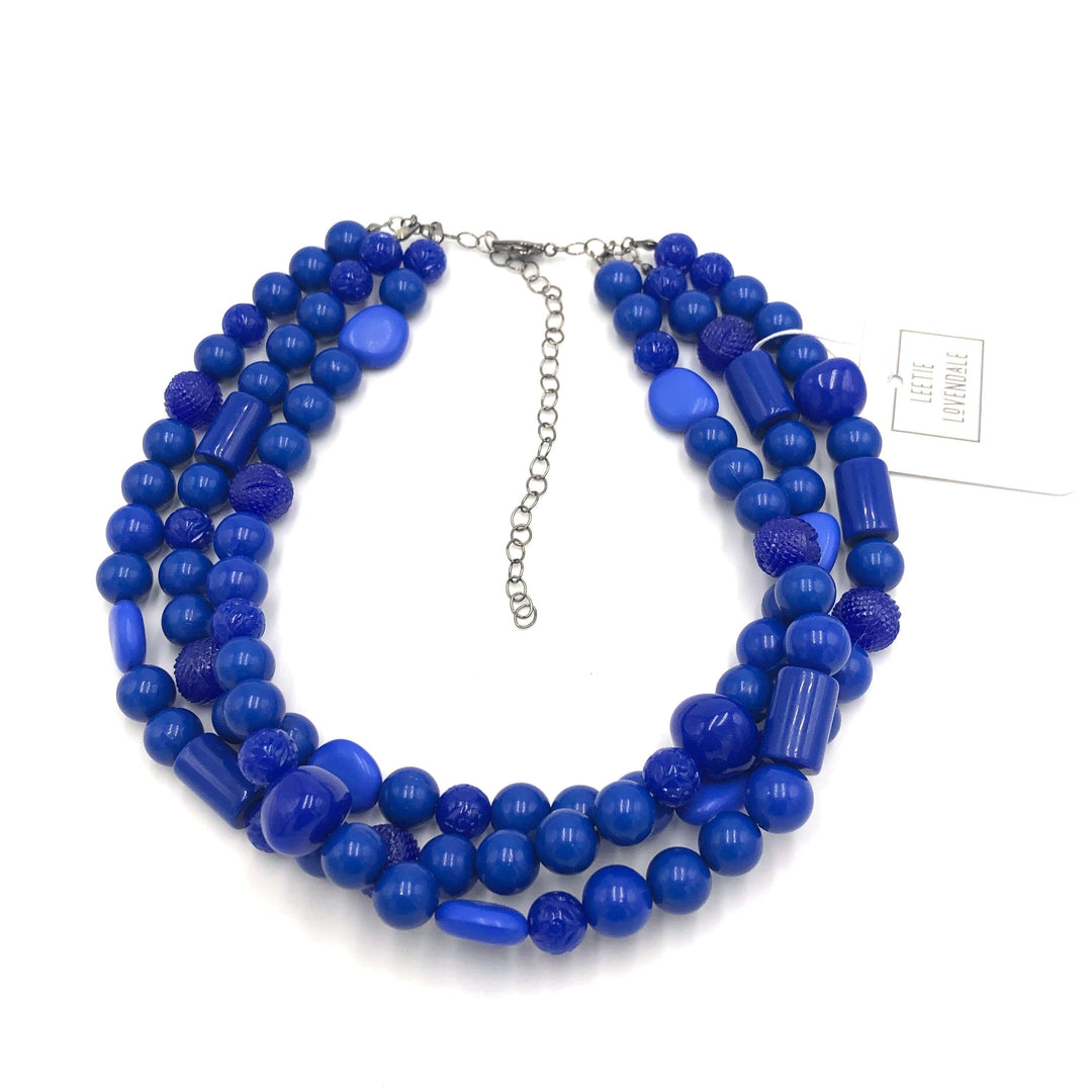 3-strand true blue shiny opaque 1960s Lucite beaded necklace, hand-finished in the USA. Sustainable vintage deadstock. 15.5-16" + 6" extender.