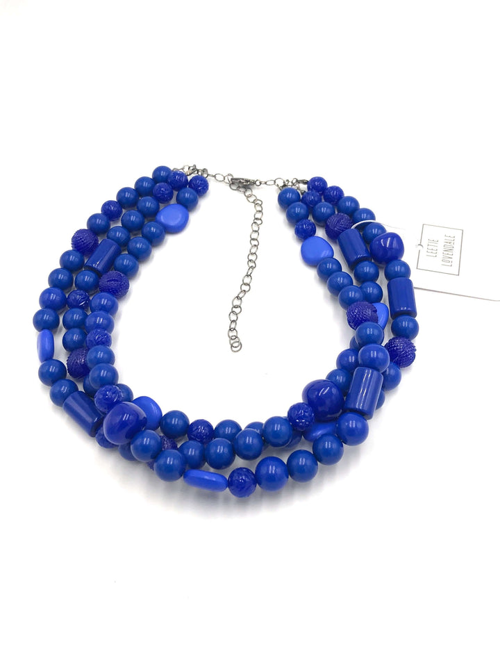 3-strand true blue shiny opaque 1960s Lucite beaded necklace, hand-finished in the USA. Sustainable vintage deadstock. 15.5-16" + 6" extender.