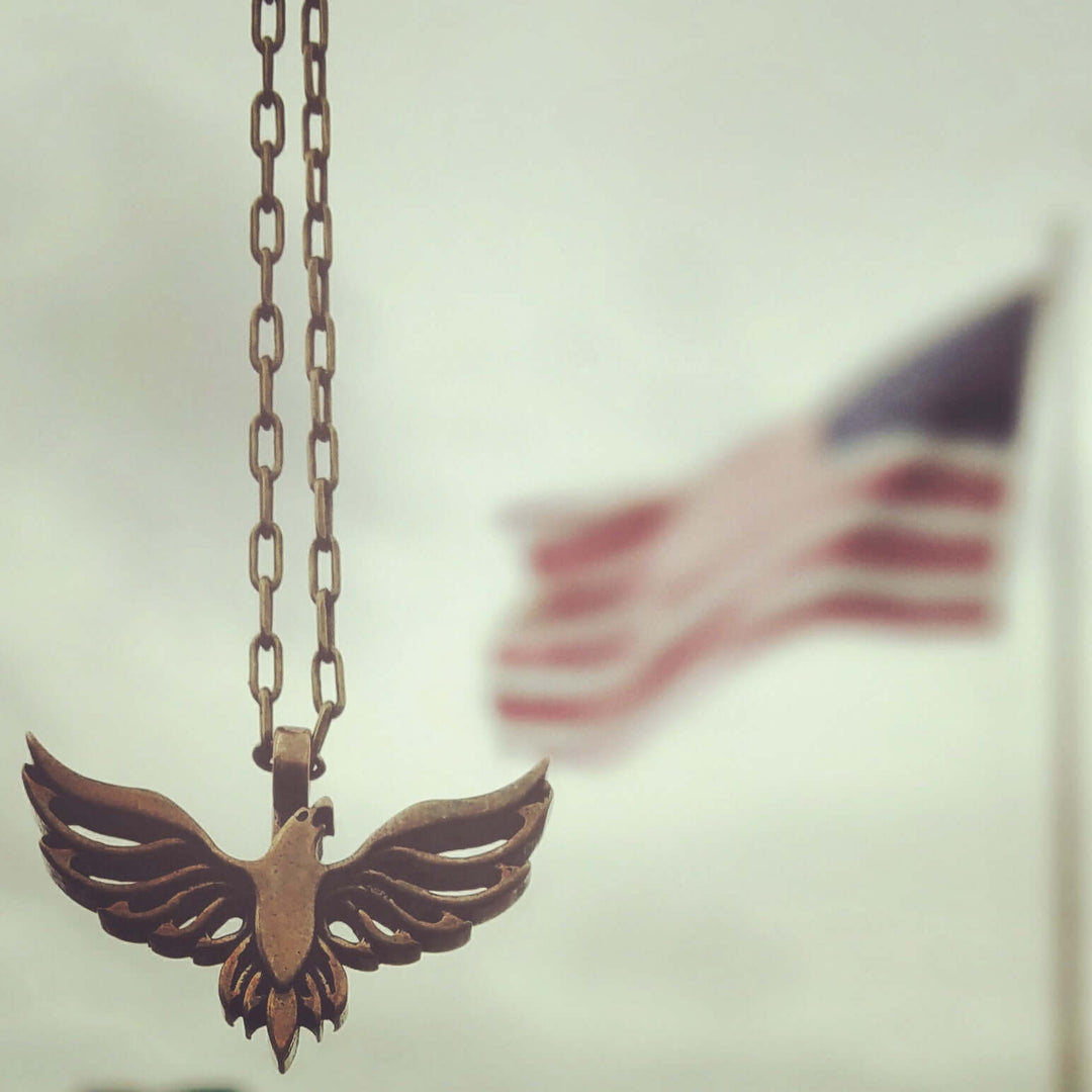 Handcrafted solid bronze eagle necklace on a 20 or 24 inch antique bronze chain. Made in USA with a lifetime warranty.