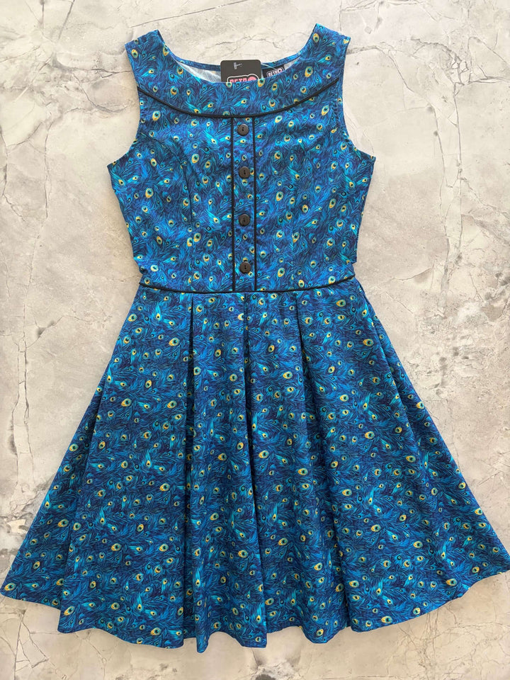 Shop the Elizabeth Dress by Retrolicious — vintage peacock print, piping details, knee length, pockets, 100% cotton. Made in USA. Sizes XS–4X.