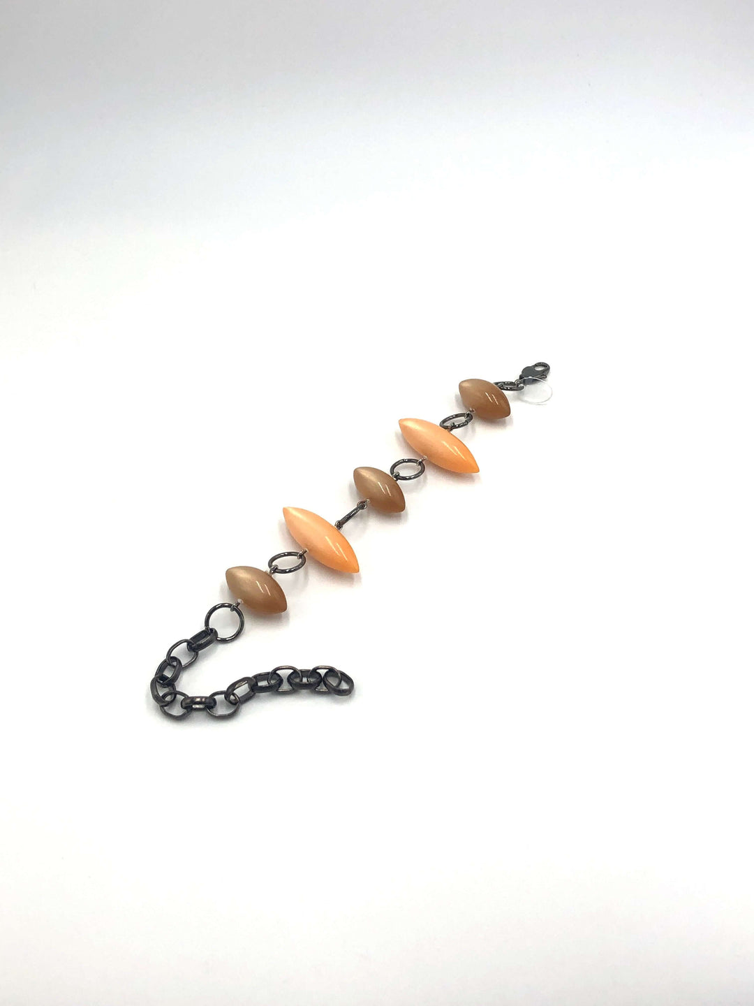 Moonglow pod station bracelet in tangerine &amp; champagne. Vintage 1960s Lucite, adjustable 6.5"-10", hypoallergenic. Stackable, made in USA.