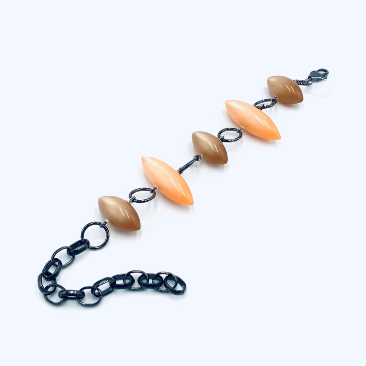 Moonglow pod station bracelet in tangerine &amp; champagne. Vintage 1960s Lucite, adjustable 6.5"-10", hypoallergenic. Stackable, made in USA.