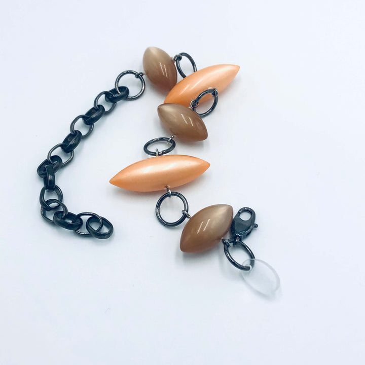Moonglow pod station bracelet in tangerine &amp; champagne. Vintage 1960s Lucite, adjustable 6.5"-10", hypoallergenic. Stackable, made in USA.