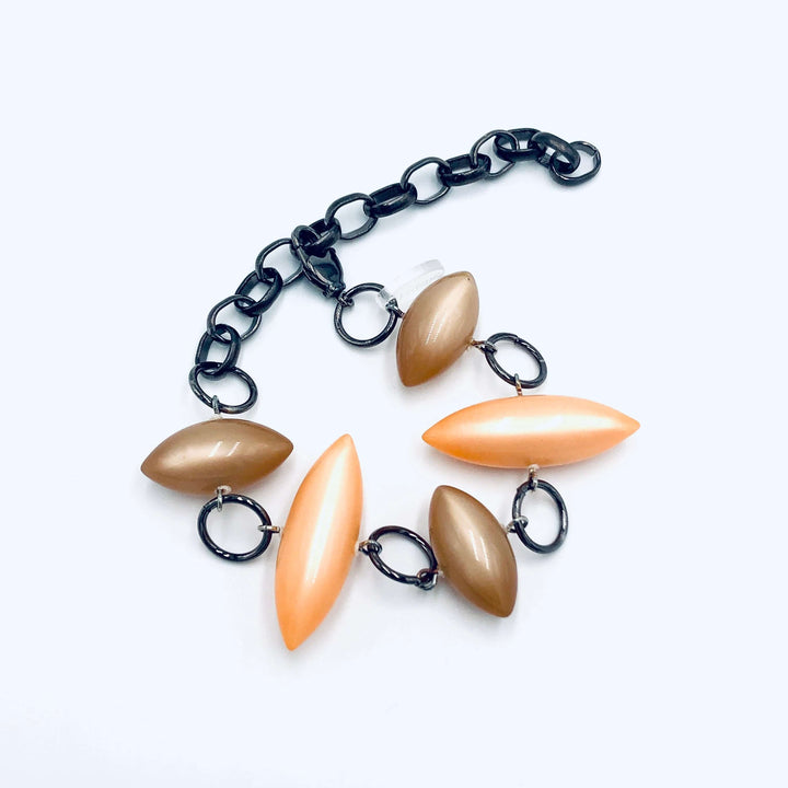 Moonglow pod station bracelet in tangerine &amp; champagne. Vintage 1960s Lucite, adjustable 6.5"-10", hypoallergenic. Stackable, made in USA.