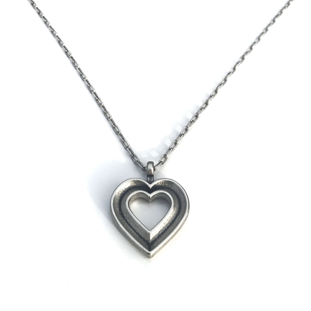 Handcrafted solid sterling silver heart necklace on an 18-24 inch stainless steel chain. Made in USA with a lifetime warranty.