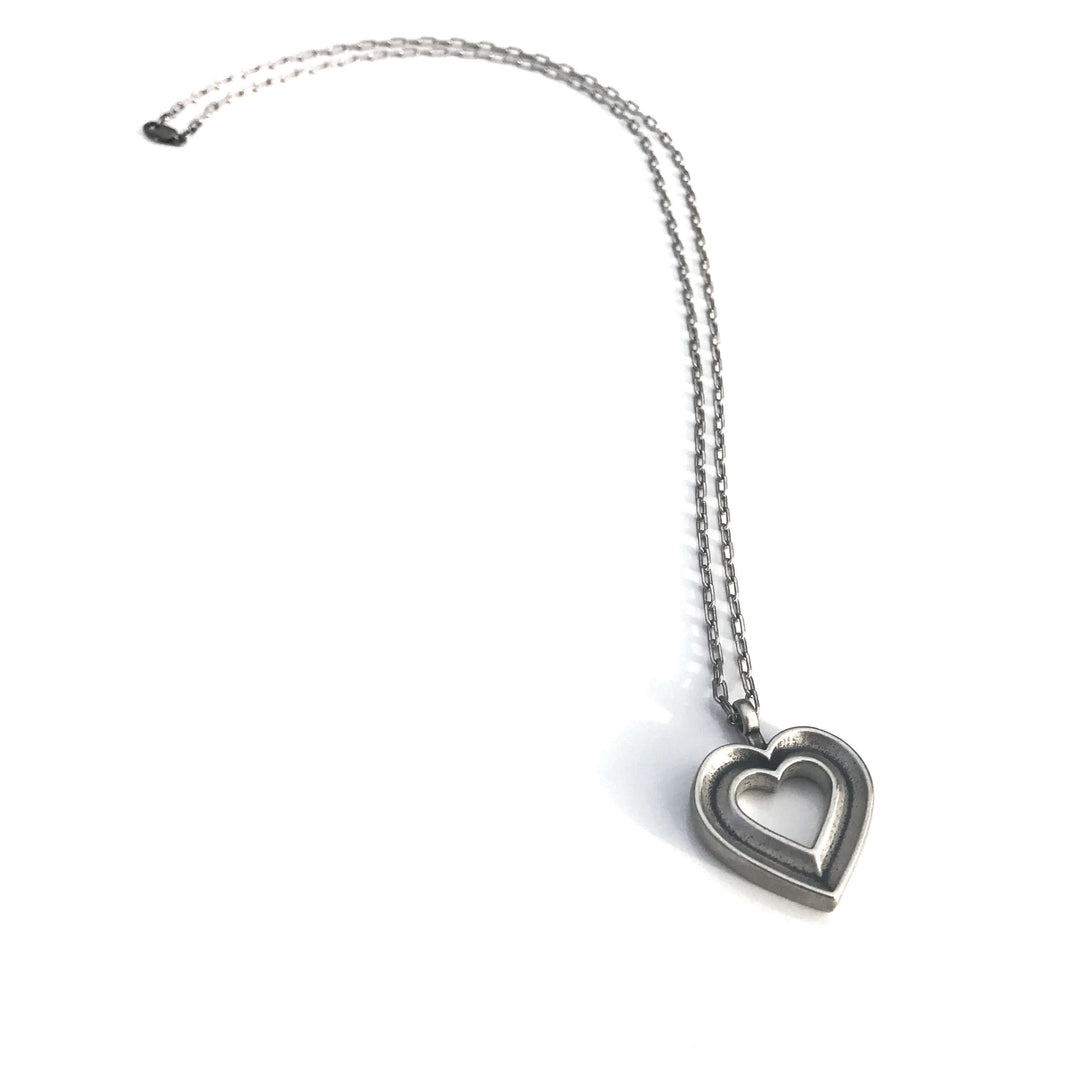 Handcrafted solid sterling silver heart necklace on an 18-24 inch stainless steel chain. Made in USA with a lifetime warranty.