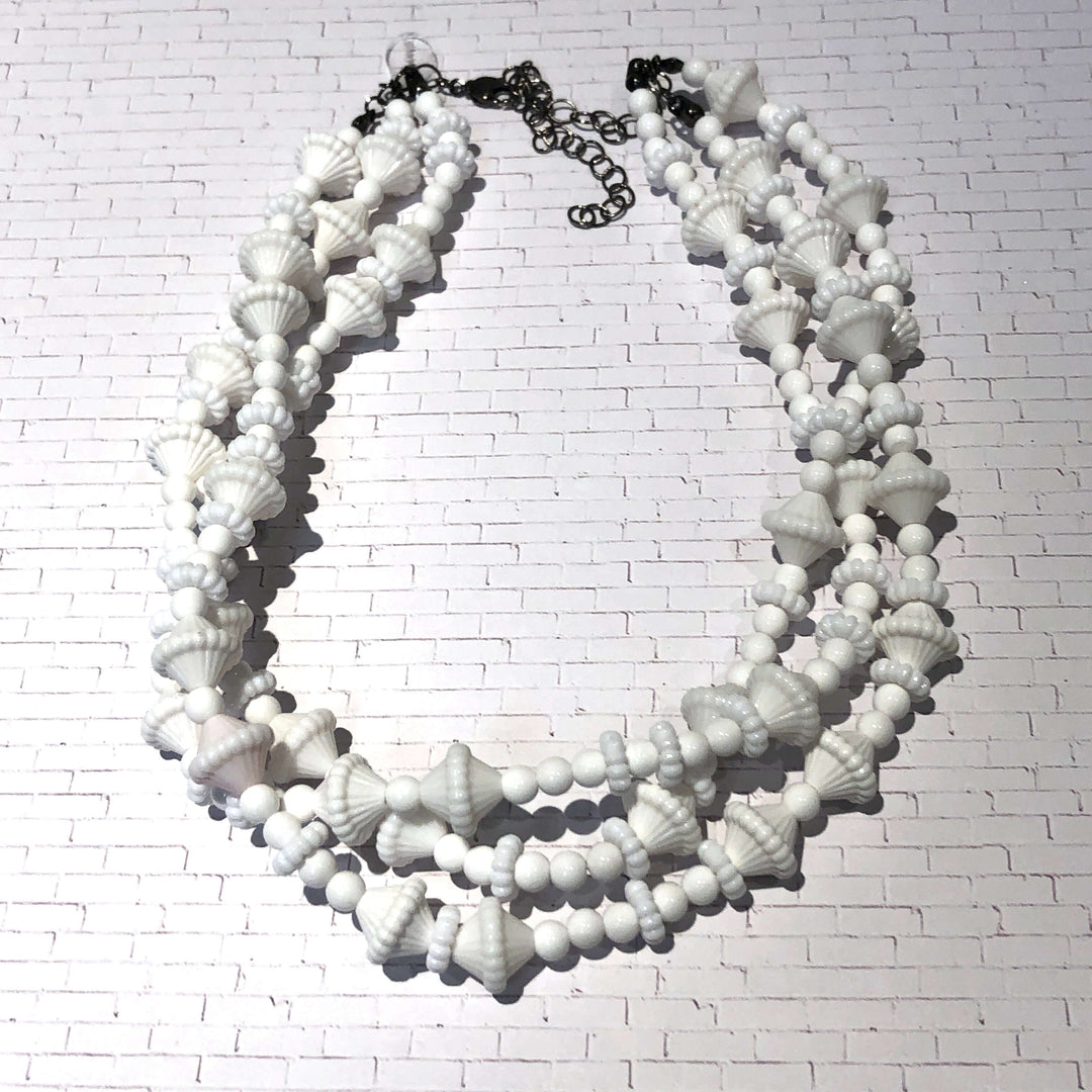3-strand opaque white 1960s Lucite beaded necklace, hand-finished in the USA. Sustainable vintage deadstock. 15.5-16" + 6" extender.