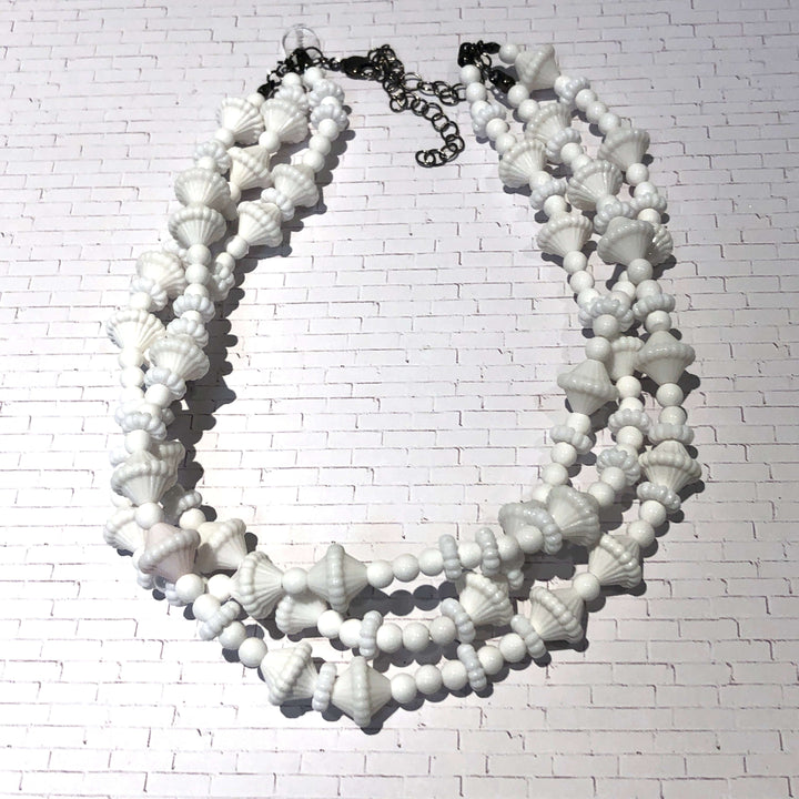 3-strand opaque white 1960s Lucite beaded necklace, hand-finished in the USA. Sustainable vintage deadstock. 15.5-16" + 6" extender.