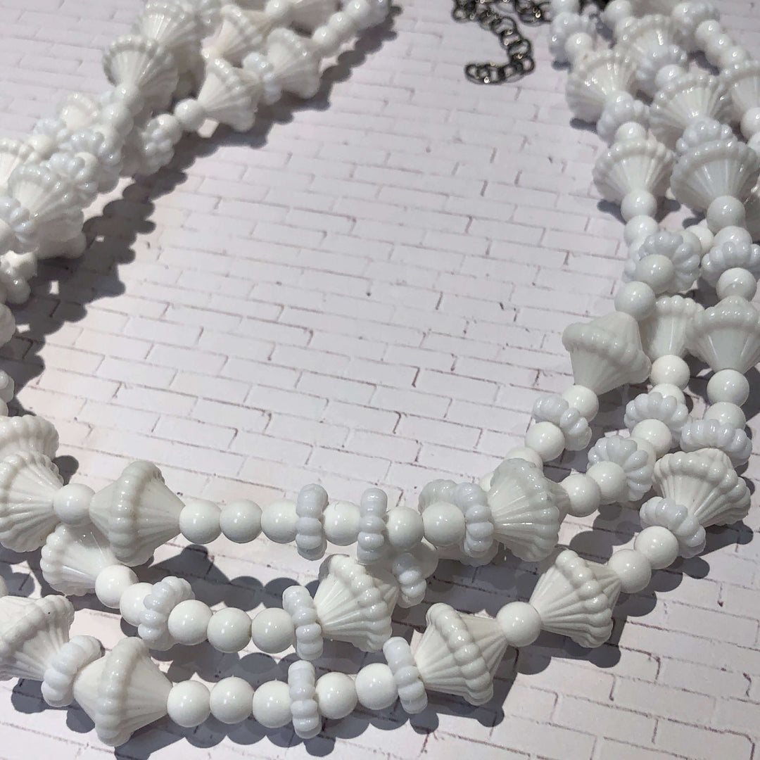 3-strand opaque white 1960s Lucite beaded necklace, hand-finished in the USA. Sustainable vintage deadstock. 15.5-16" + 6" extender.