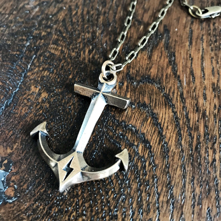 Handcrafted solid bronze anchor necklace on an antique bronze chain. Unisex. Custom lengths available. Made in USA with a lifetime warranty.