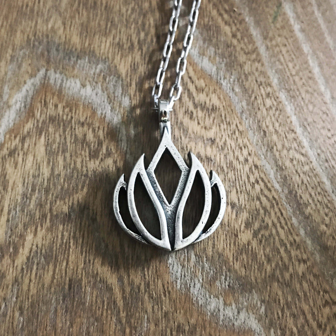 Handcrafted solid sterling silver lotus flower necklace on an 18-24 inch stainless steel chain. Made in USA with a lifetime warranty.