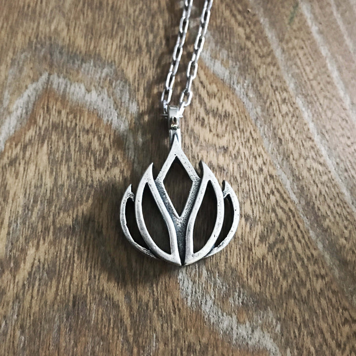 Handcrafted solid sterling silver lotus flower necklace on an 18-24 inch stainless steel chain. Made in USA with a lifetime warranty.