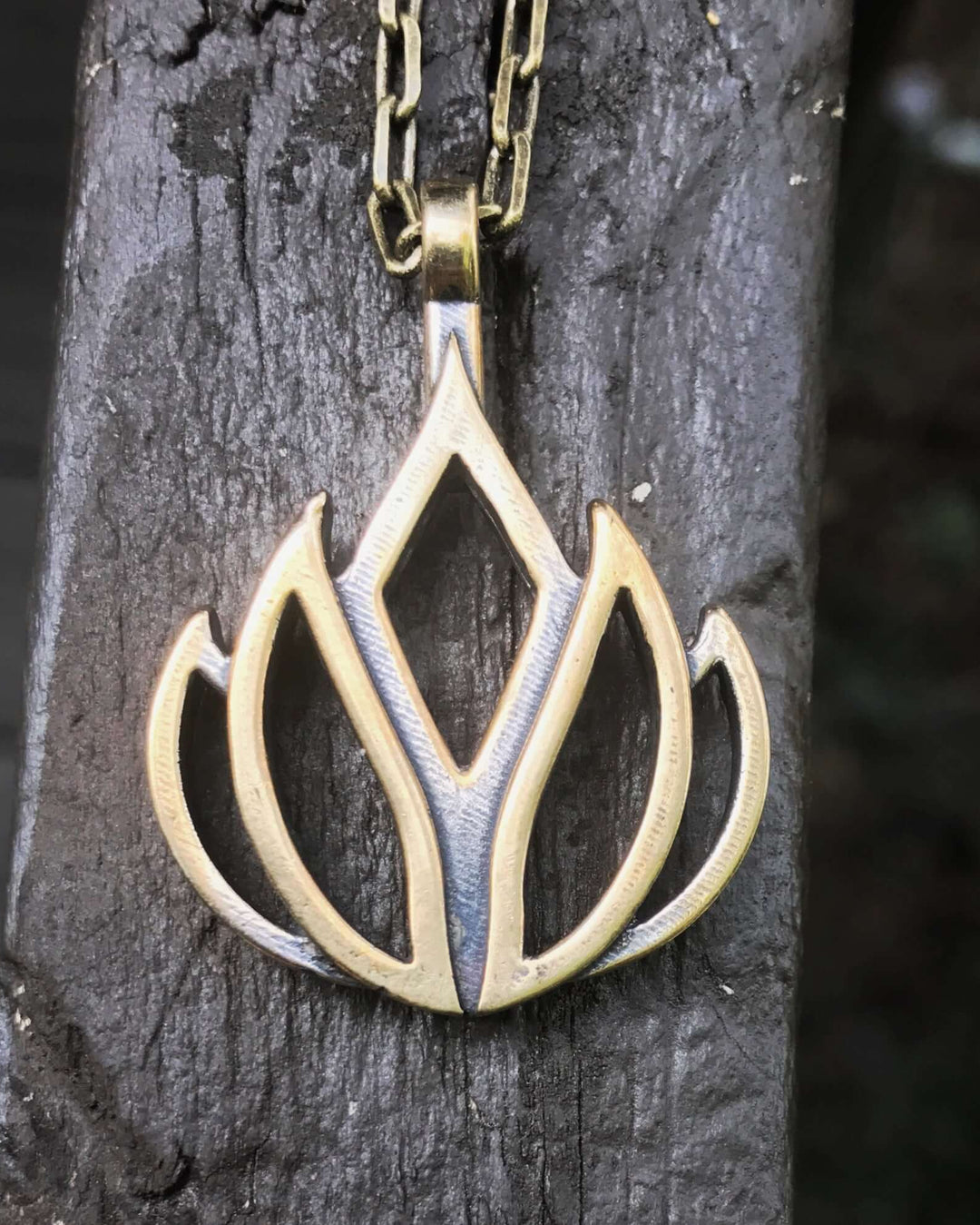 Handcrafted solid bronze lotus flower necklace on an 18 or 24 inch antique bronze chain. Made in USA with a lifetime warranty.