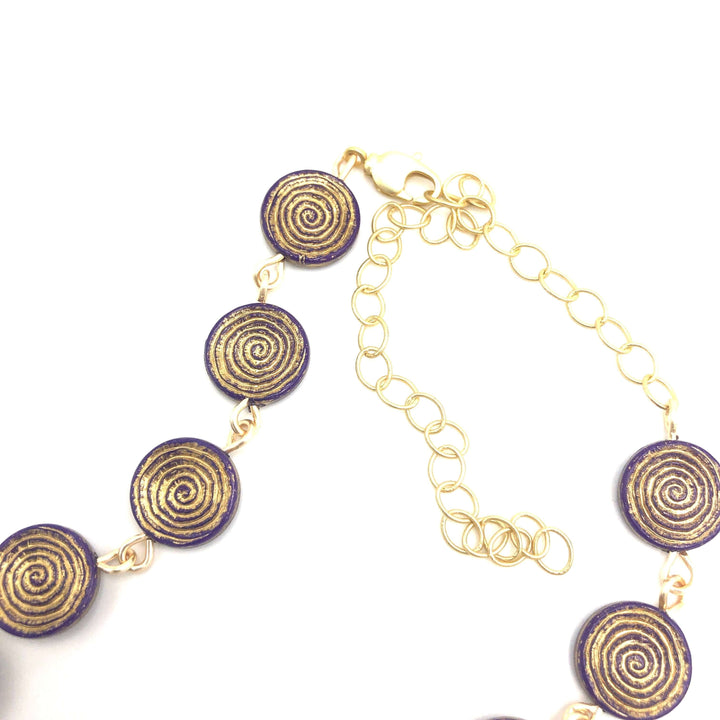 Deep purple German Lucite beads with gold spiral etching, hand-linked rosary style. Vintage deadstock, handcrafted in the USA.