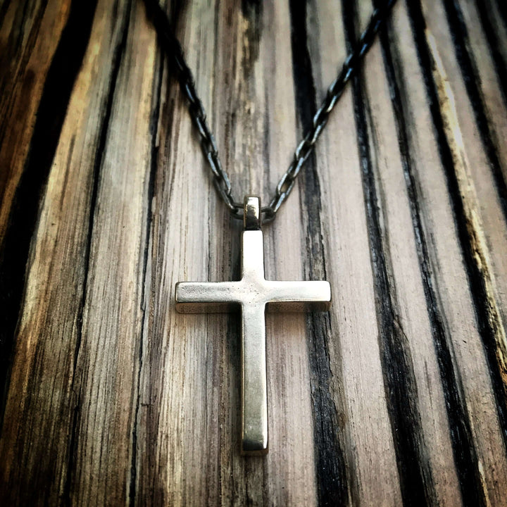Handcrafted solid bronze cross necklace on an antique bronze chain. Custom lengths available. Made in USA with a lifetime warranty.