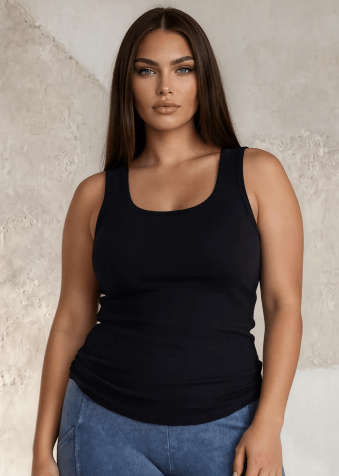 The Tummy Tucker by Bra30 is an extra-long extra supportive racerback tank top that comfortably helps smooth out those unwanted lumps and bumps. Made with 90% Cotton and 10% Spandex this ribbed fabric was 100% made with your comfort in mind. Proudly made for women by a woman, here in the USA A bra 30 tank designed with soft compression to smooth and support without squeezing. The Tummy Tucker is flattering, breathable, and fits like a dream.